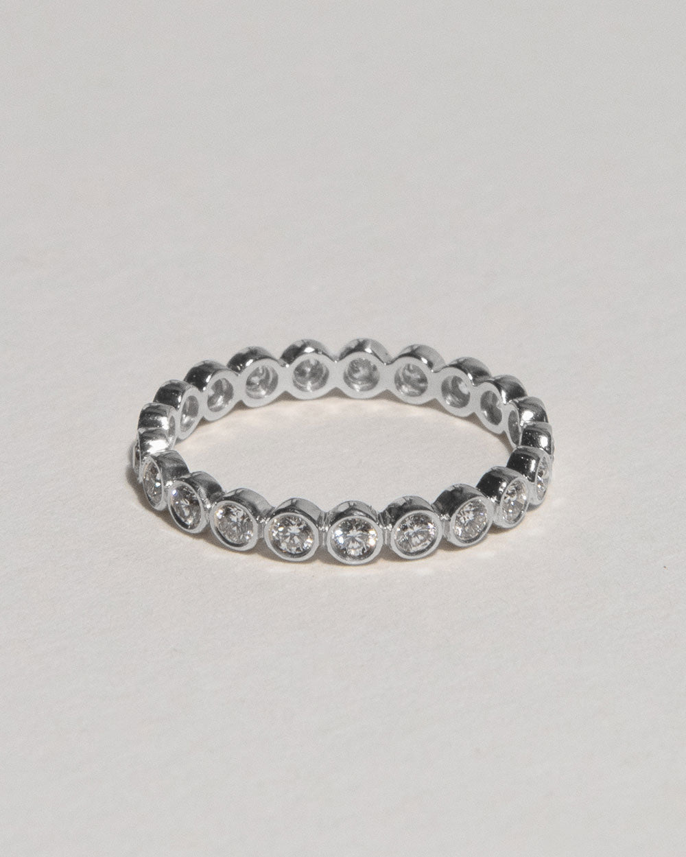 Platinum Bezel Diamond Eternity Ring on white background 