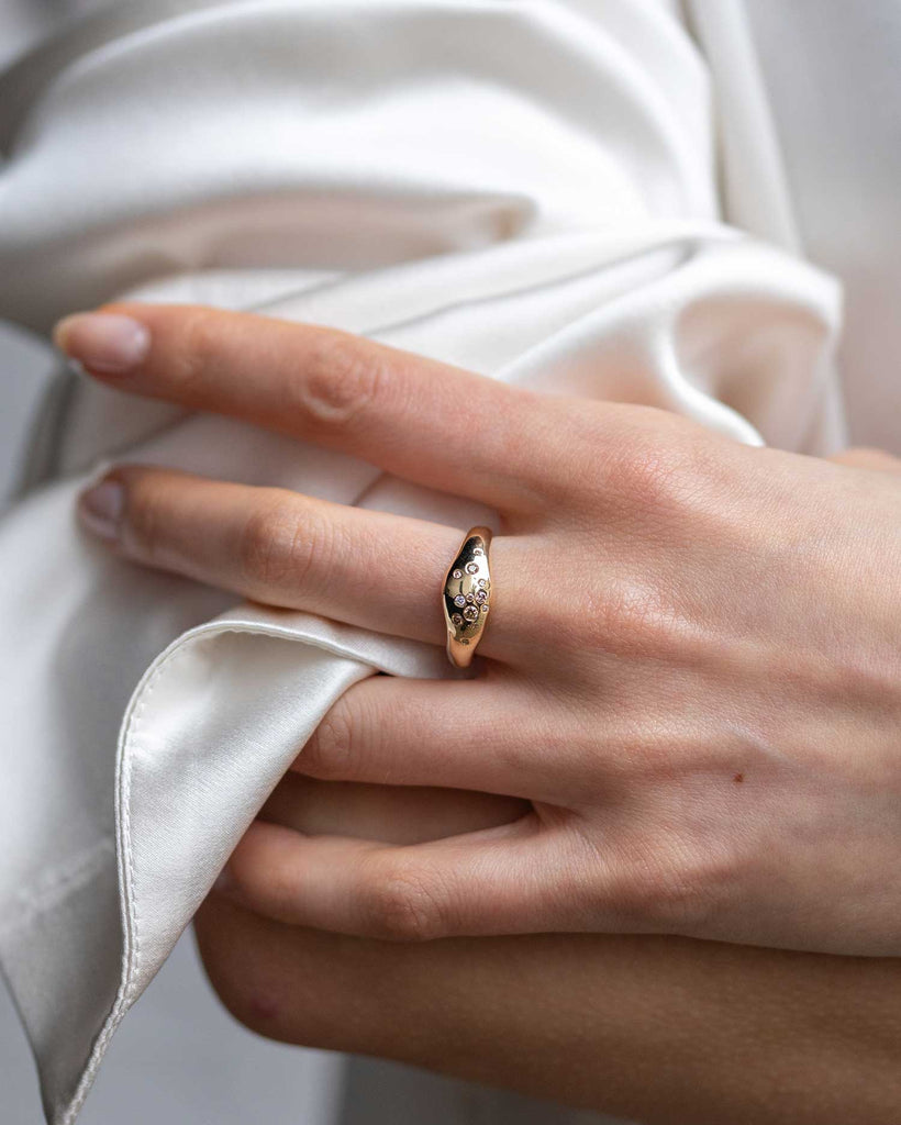 Recycled 9ct solid yellow gold sculptural signet ring with finely set white and champagne natural diamonds handcrafted in London by Maya Magal London