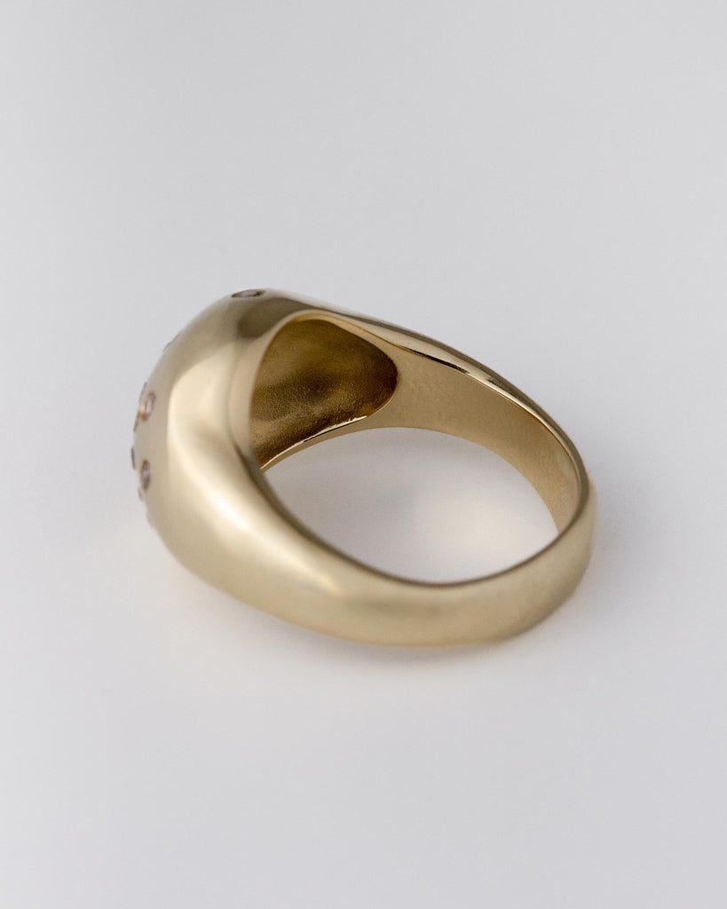 Recycled 9ct solid yellow gold statement signet ring with finely set white and champagne natural diamonds handcrafted in London by Maya Magal London