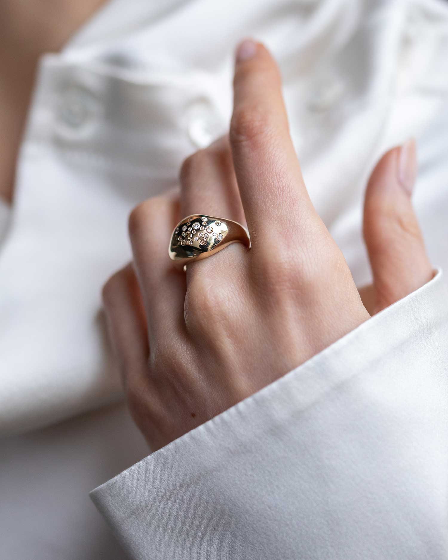 Recycled 9ct solid yellow gold statement signet ring with finely set white and champagne natural diamonds handcrafted in London by Maya Magal London