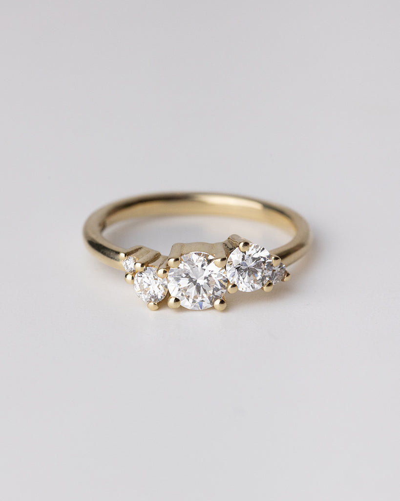 Cluster ring with lab grown white diamonds set in a recycled 9 ct solid yellow gold band handcrafted in London by Maya Magal