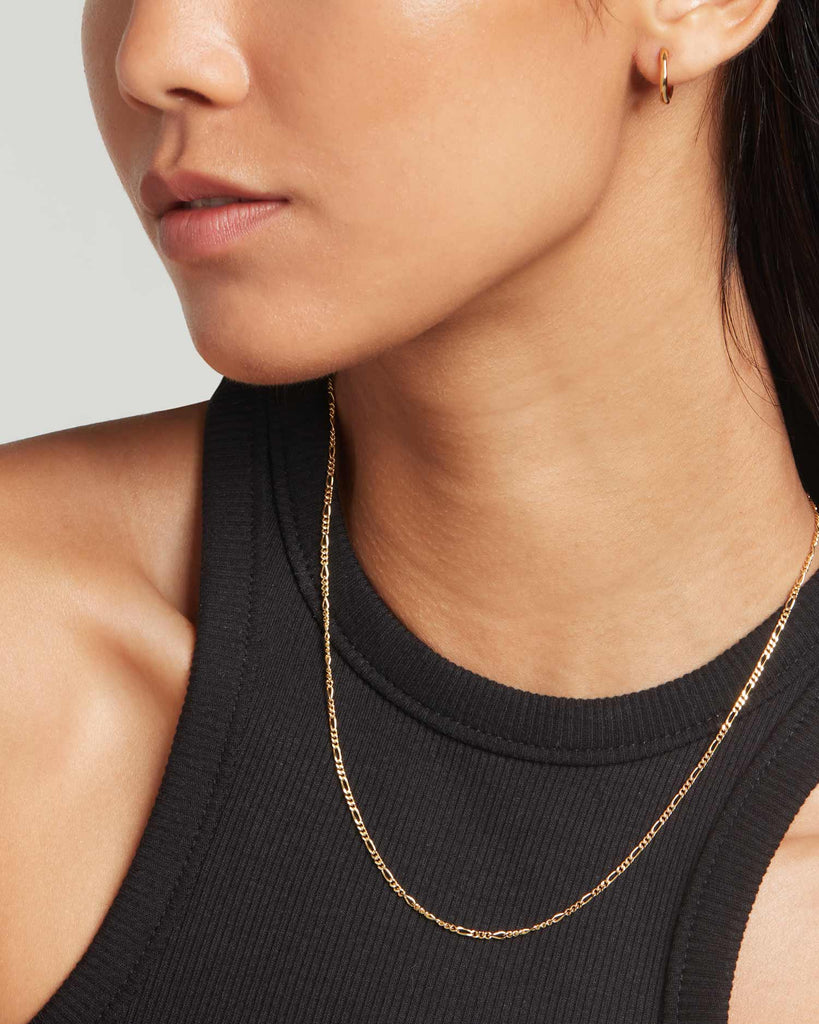 model wears 18ct gold plated sterling silver figaro chain necklace by Maya Magal