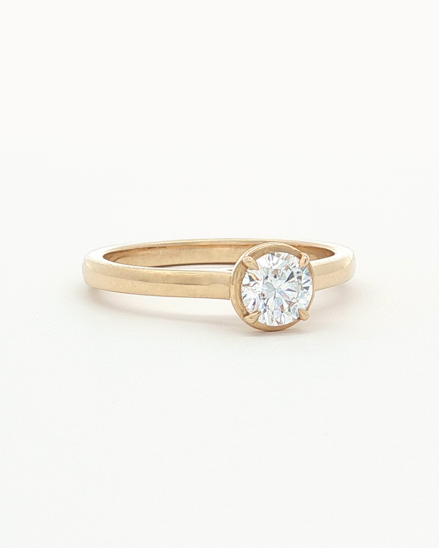 front/side view of 0.5ct Lab Grown Diamond Halo Ring with 9 Ct solid gold band on white background