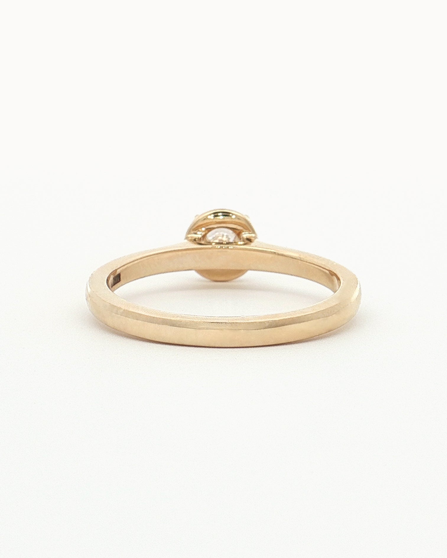back view of 0.5ct Lab Grown Diamond Halo Ring with 9 Ct solid gold band on white background