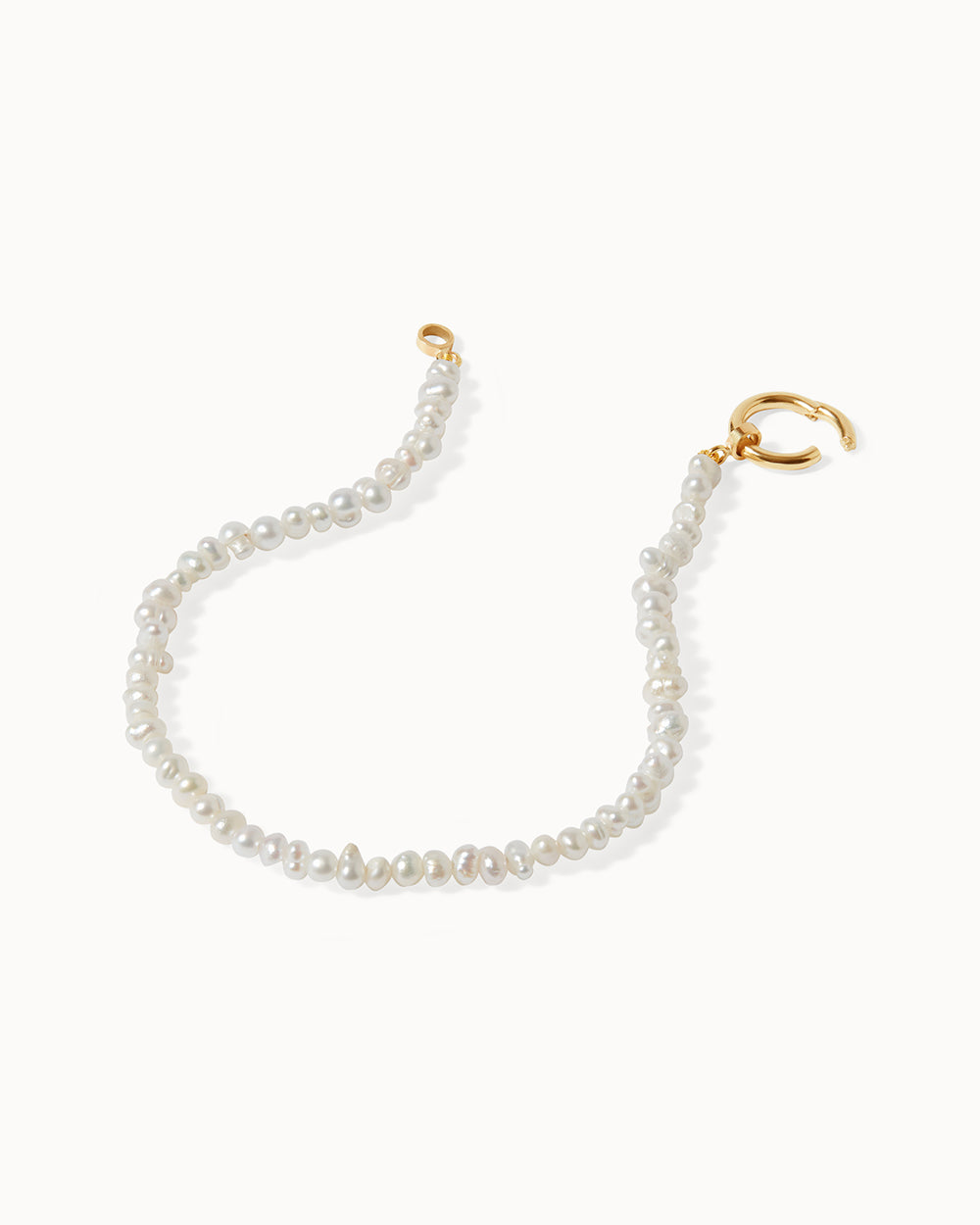 Elegant Milos pearl charm bracelet in solid gold with delicate beaded design by Maya Magal London