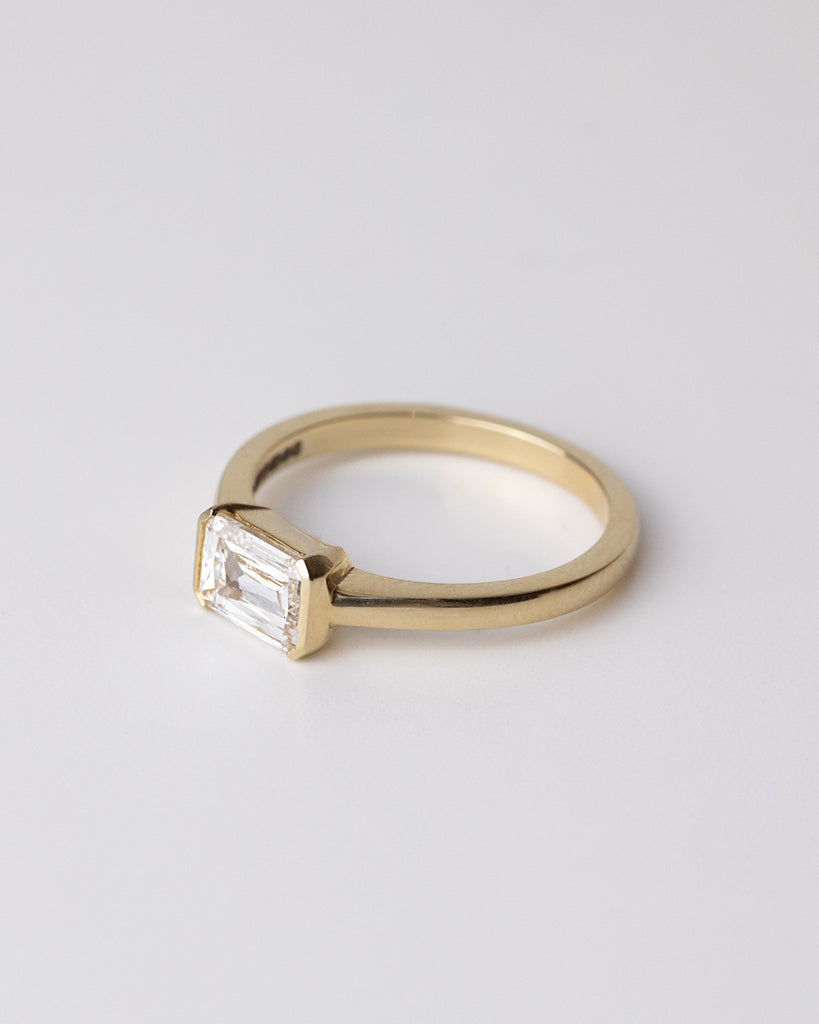 Scissor cut lab grown white diamond solitaire ring set in a recycled 9 ct solid yellow gold band handcrafted in London by Maya Magal