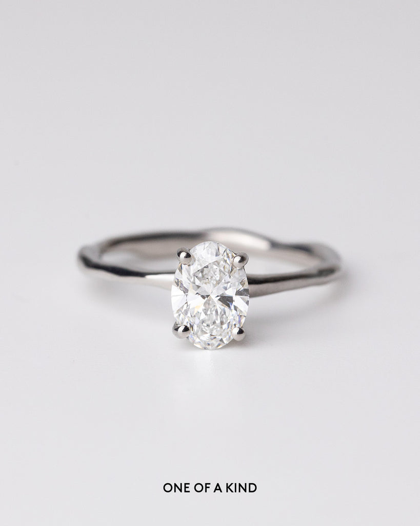 Oval cut lab grown diamond solitaire ring set in a recycled 9 ct solid white gold organic band handcrafted in London by Maya Magal
