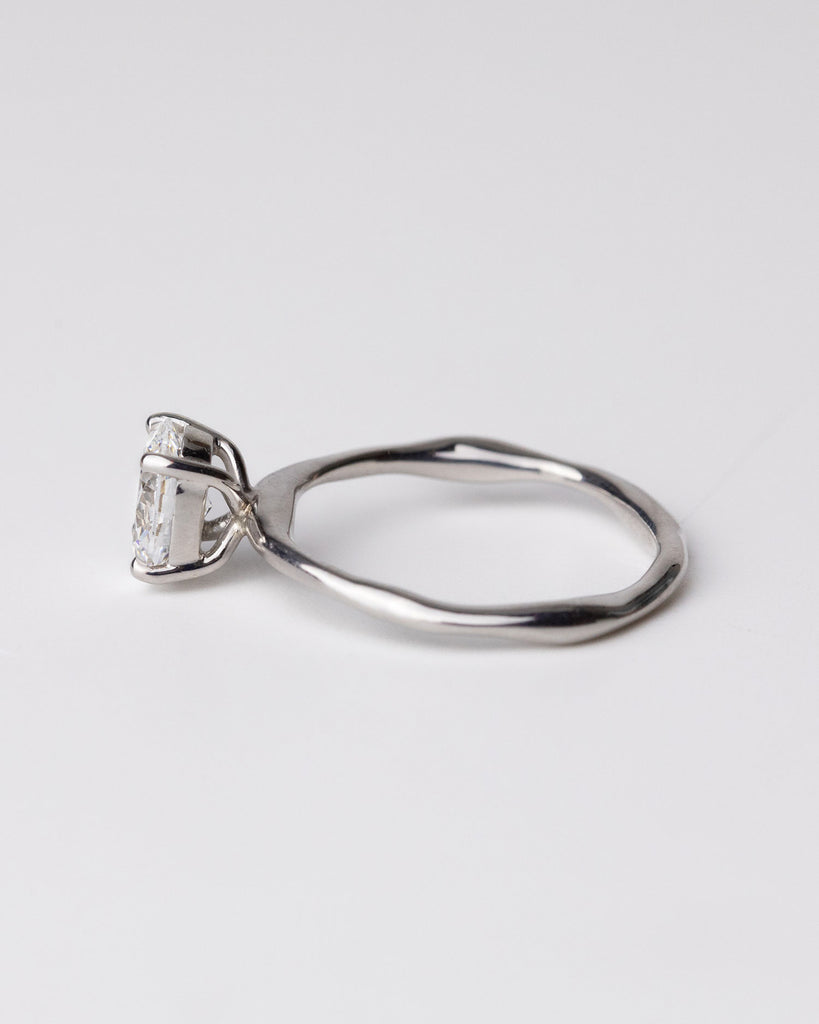 Oval cut lab grown diamond solitaire ring set in a recycled 9 ct solid white gold organic band handcrafted in London by Maya Magal