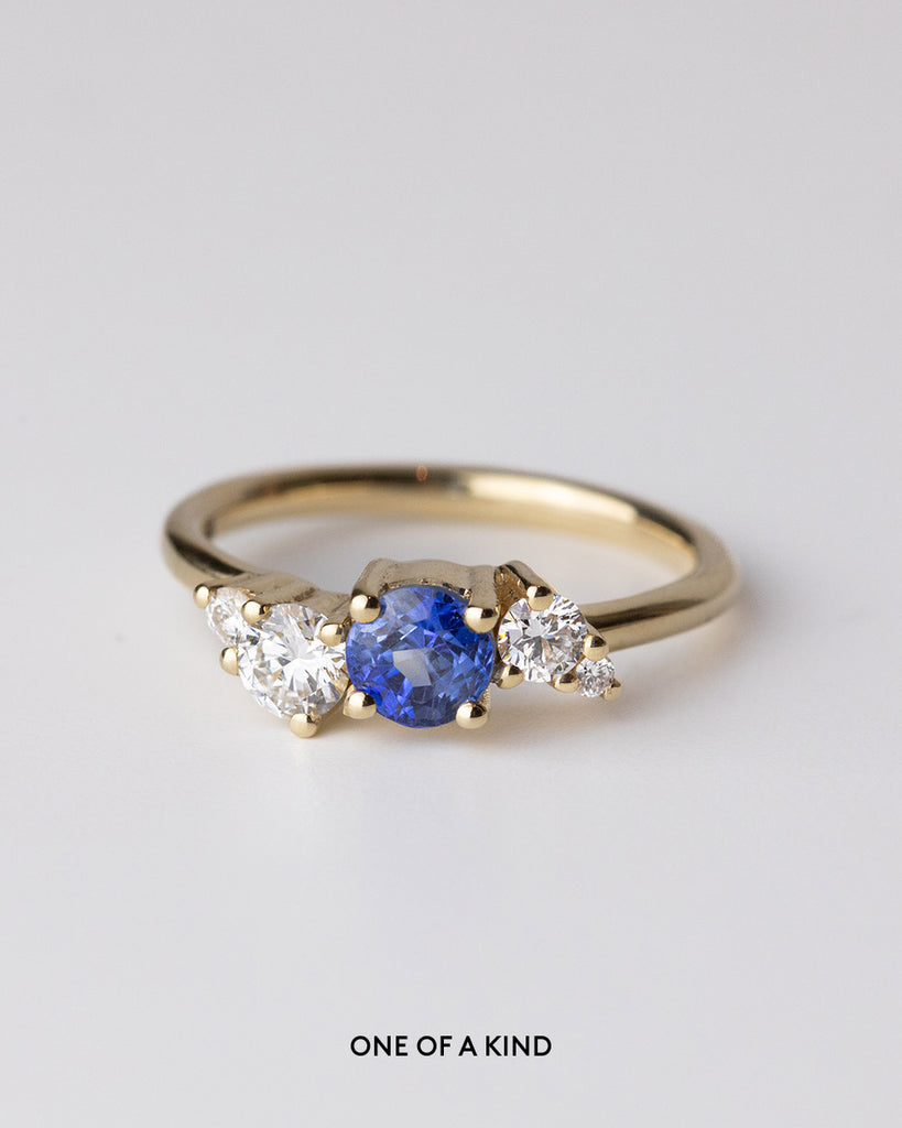 Sri Lankan blue sapphire cluster with lab grown white diamonds ring set in a recycled 9 ct solid yellow gold band handcrafted in London by Maya Magal