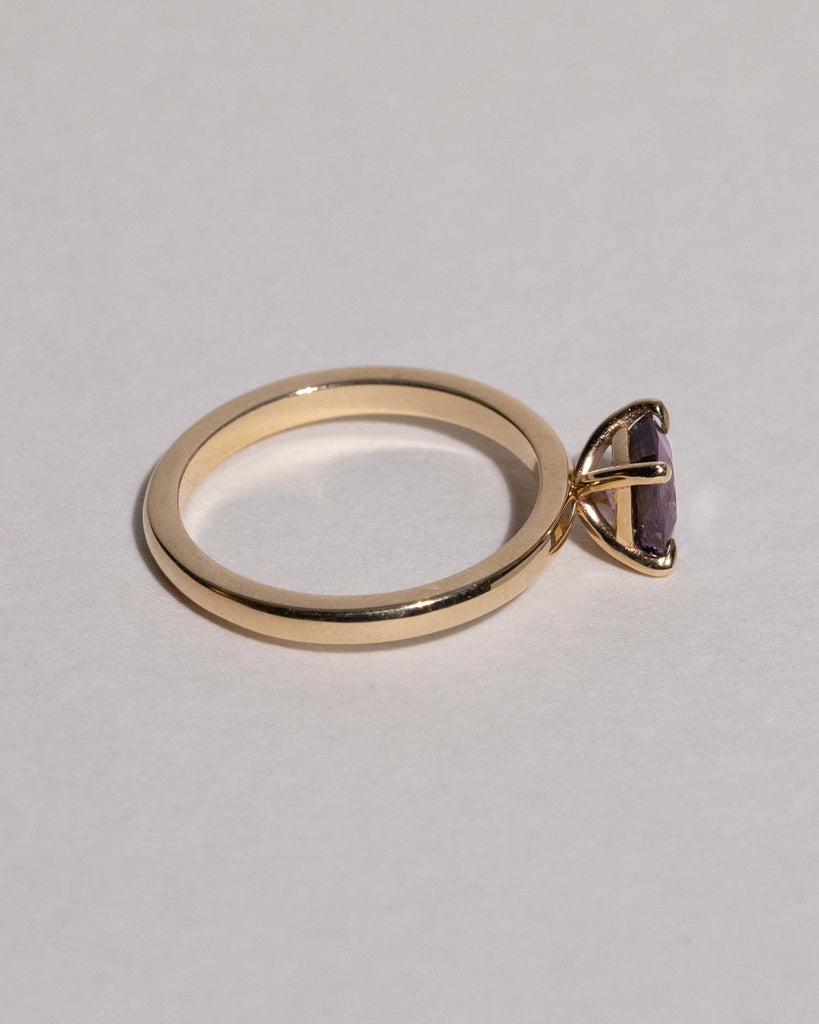 Purple Spinel solitaire engagement ring   set on a recycled solid gold band handmade in London by Maya Magal London