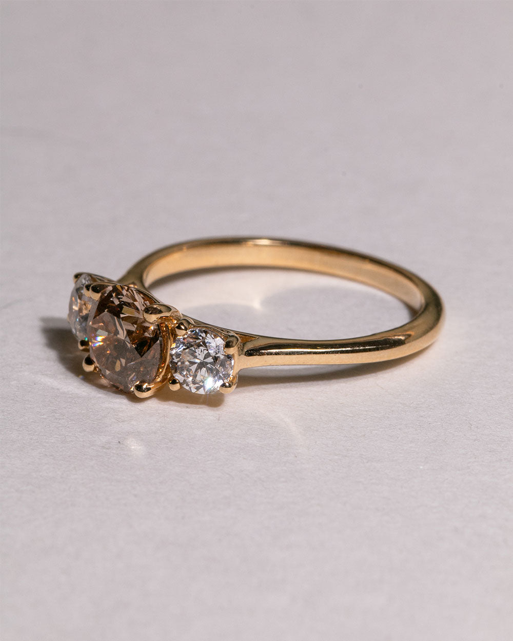 side view photo of 18Ct solid gold Noor 1.02ct Champagne Diamond Ring on white backdrop