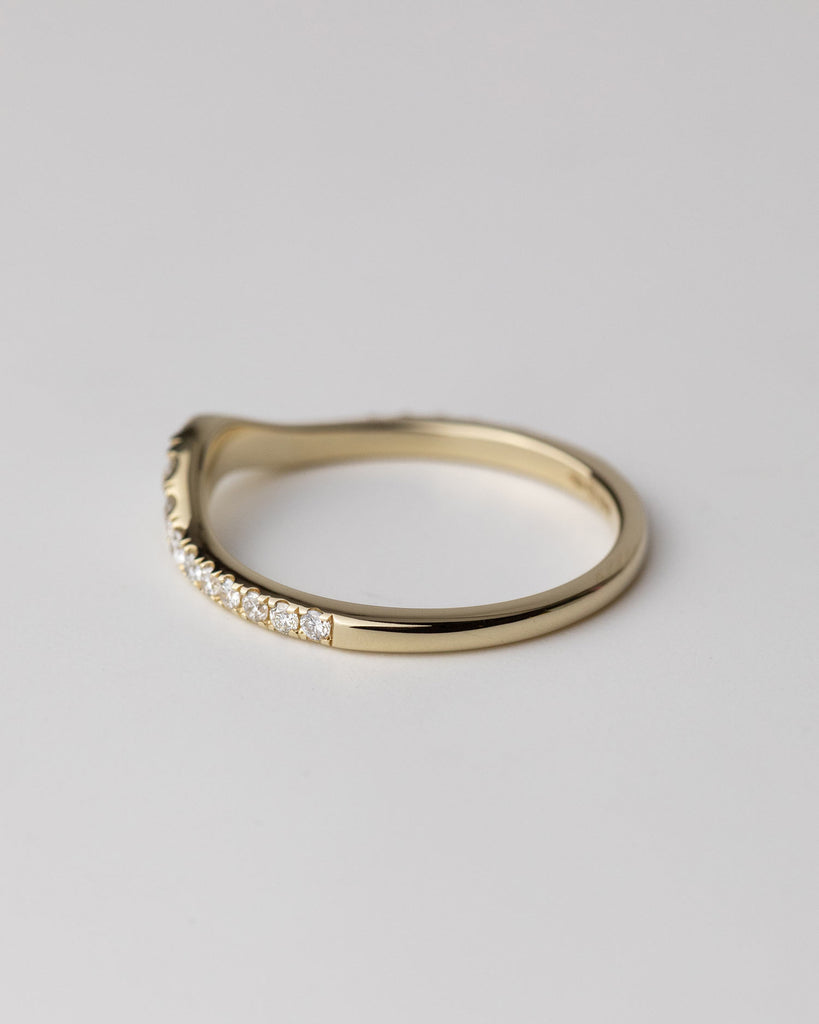 recycled 9ct solid yellow gold wishbone wedding band with pavé set diamonds crafted with sloping U shape in London by Maya Magal