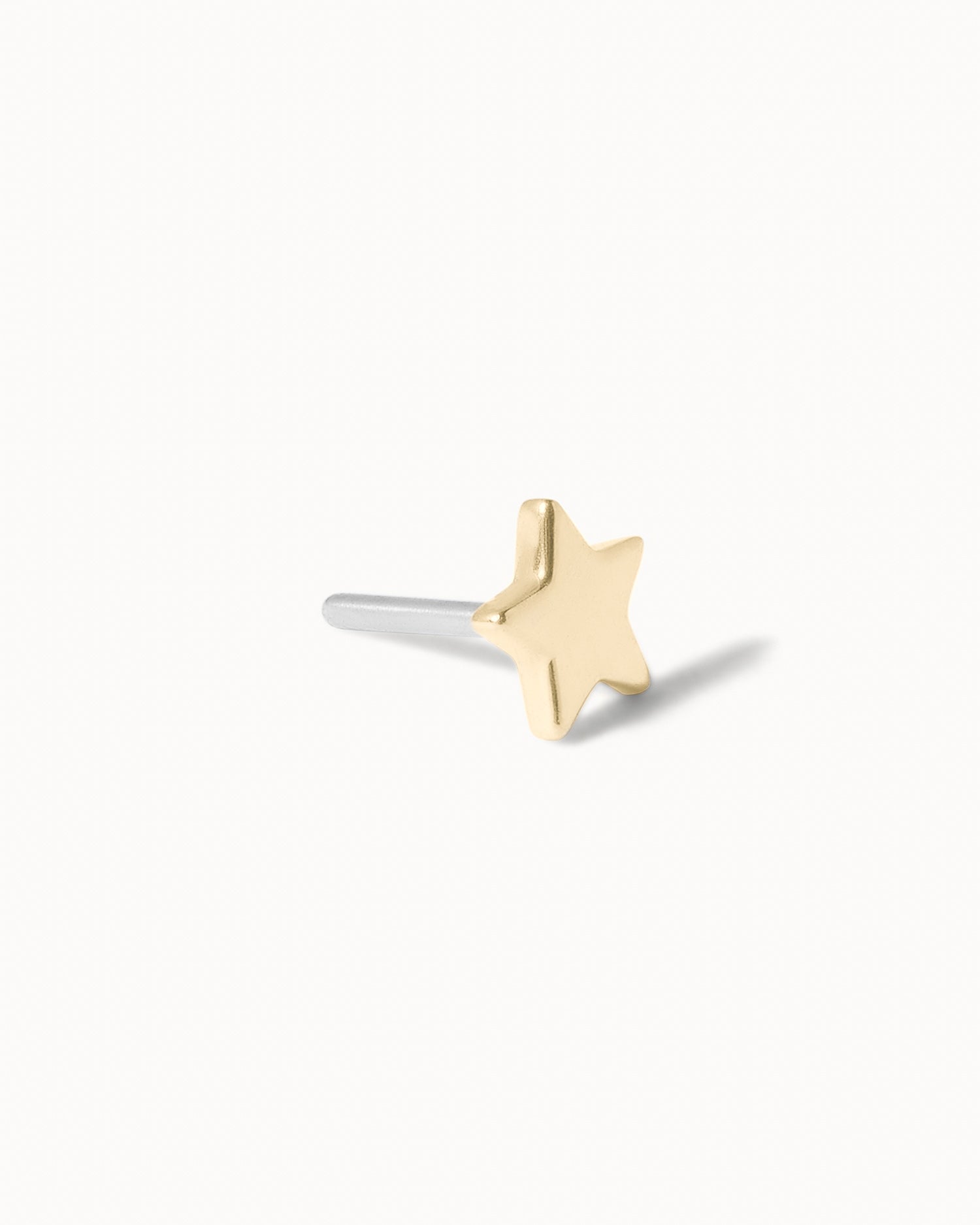 Front/side view of star threadless stud earring.