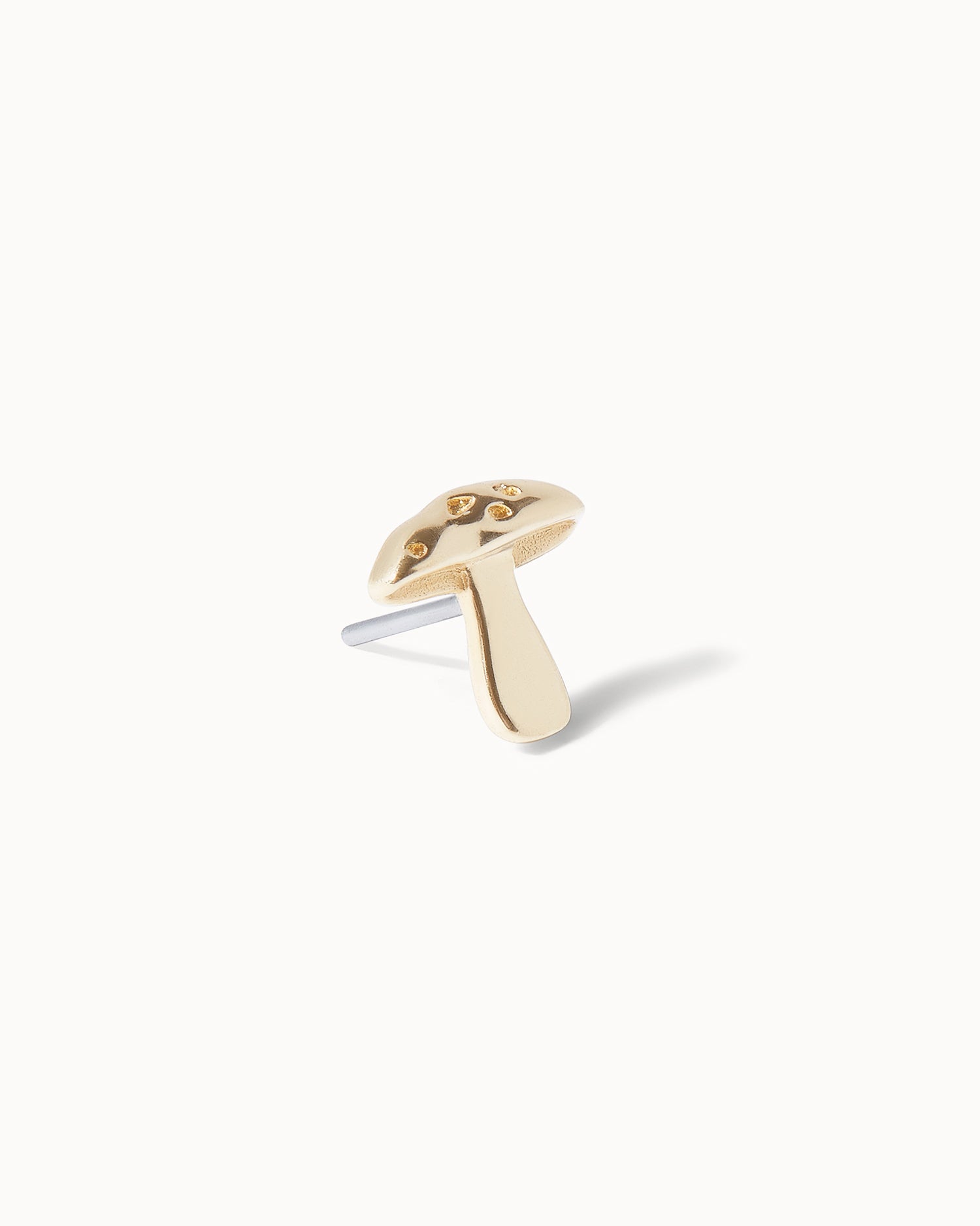 Mushroom recycled solid gold threadless jewellery stud on white background.