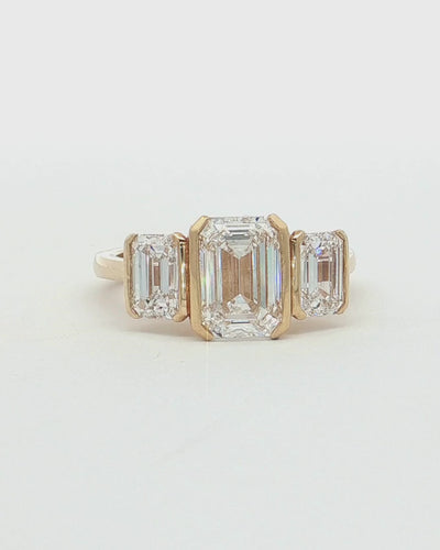 360 video of 9ct Gold 2.05ct Emerald Cut Lab Grown Diamond Trilogy Ring.