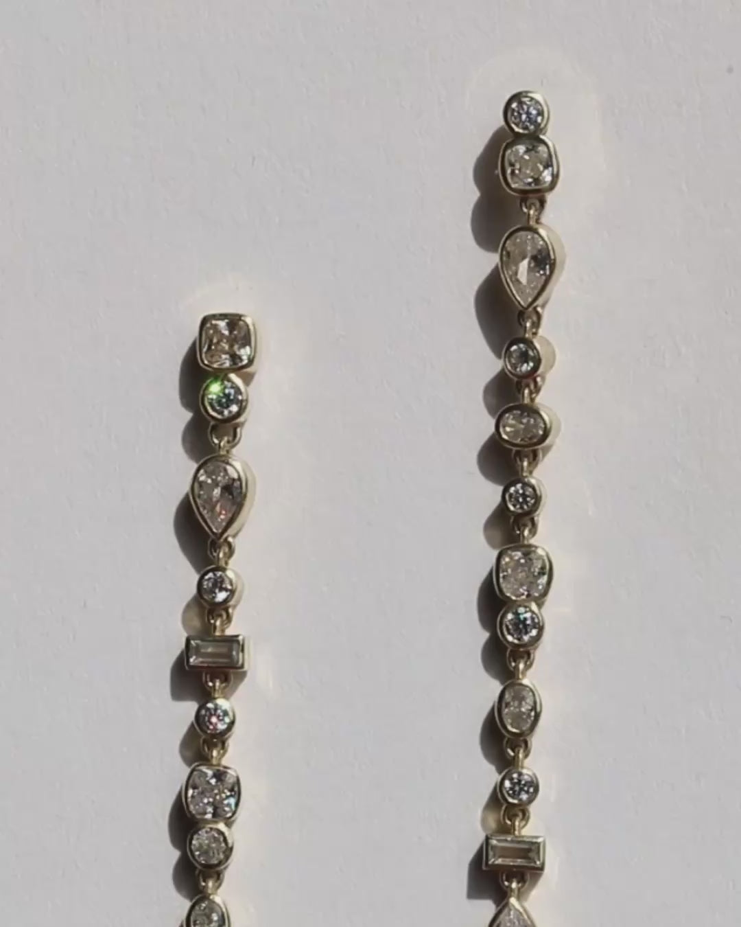 Video of Vega Diamond Drop Earrings on white background. 