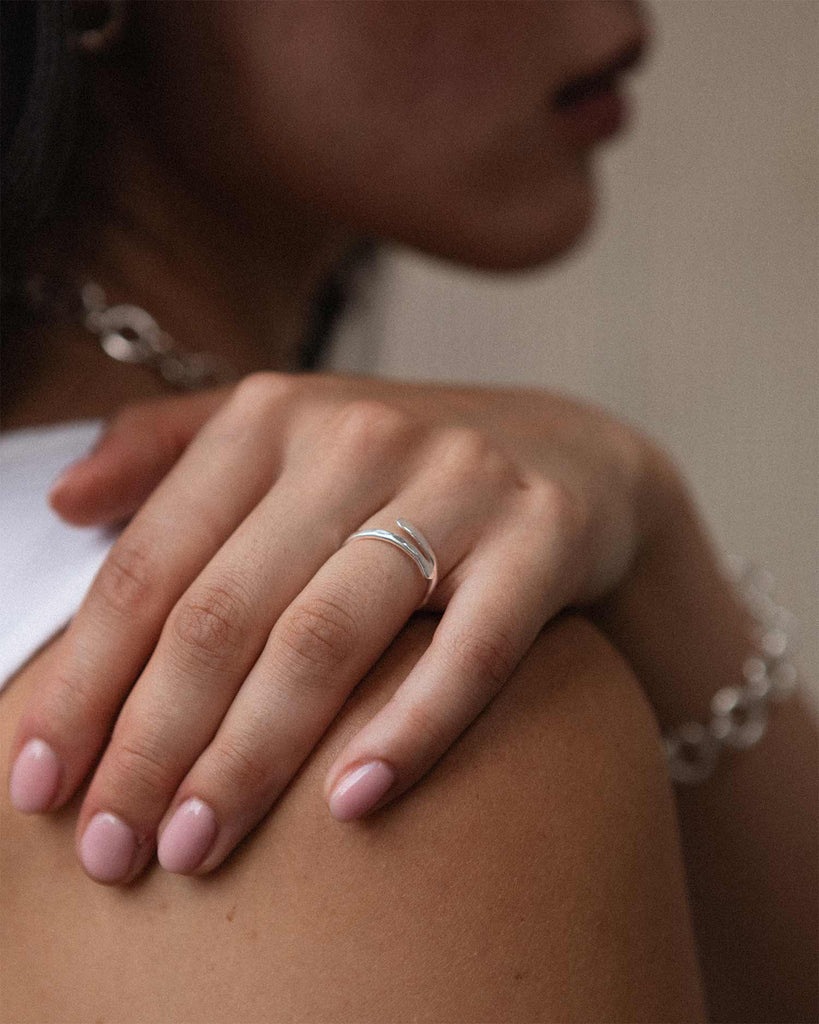 Sculptural adjustable ring in sterling silver with hammered finish handcrafted in London by Maya Magal London