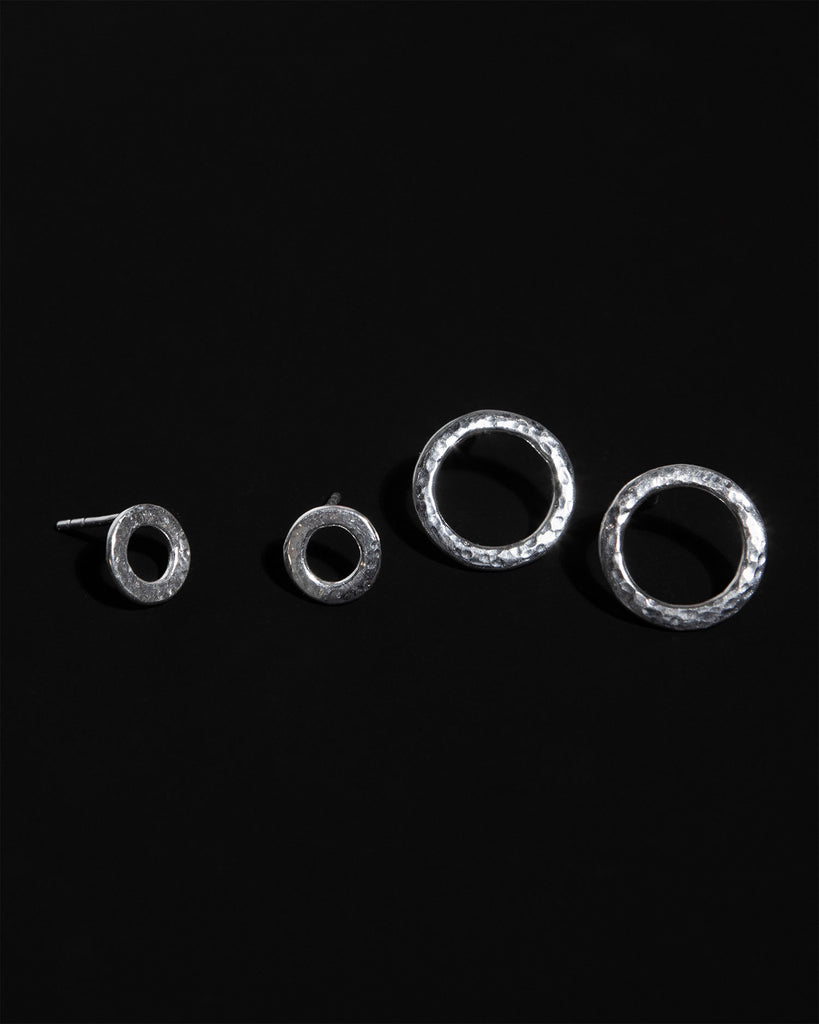 Statement sterling silver circular stud earrings with hammered texture handcrafted in London by Maya Magal London