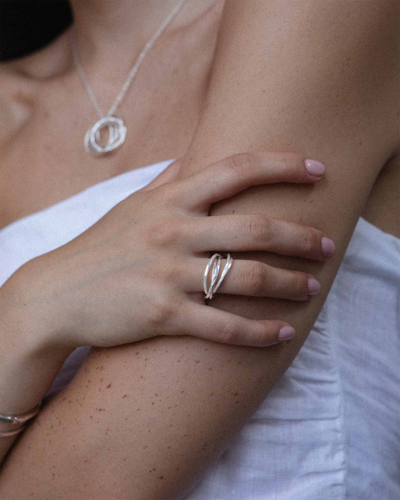 sterling silver interlocking rings with hammered texture handcrafted in London by Maya Magal London