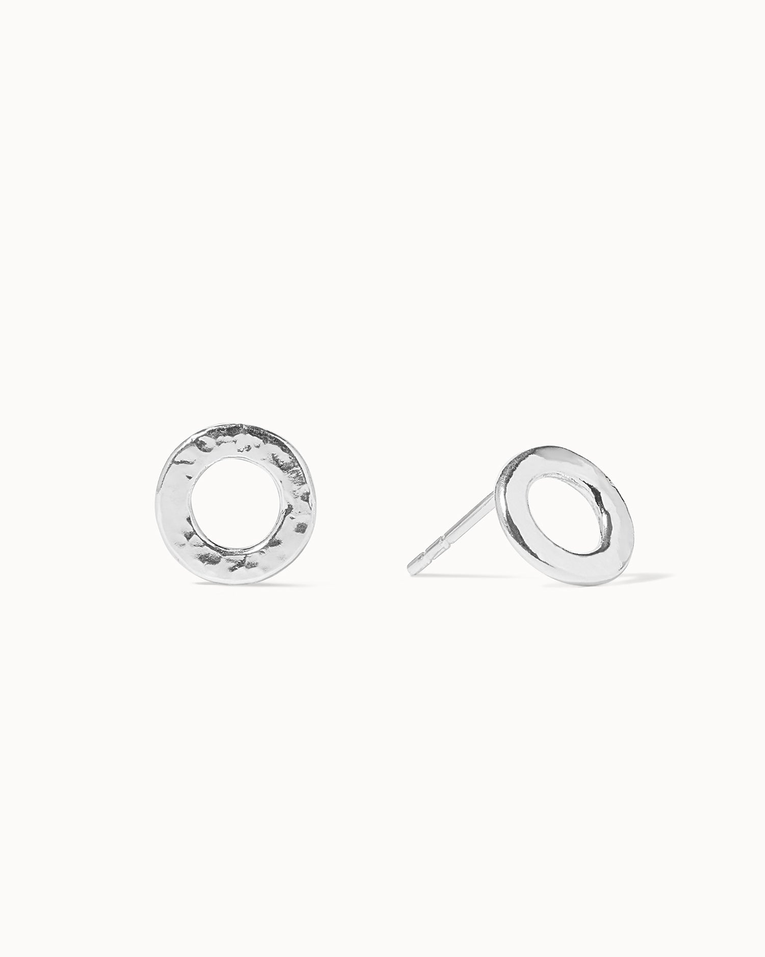 Statement sterling silver circular small stud earrings with hammered texture handcrafted in London by Maya Magal London