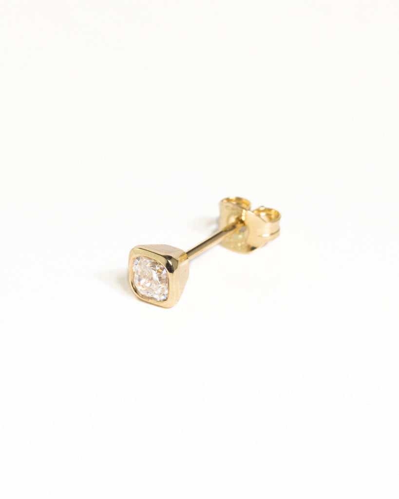 cushion cut 0.2ct lab grown white diamond stud earring encased in recycled solid gold bezel handcrafted in London by Maya Magal London