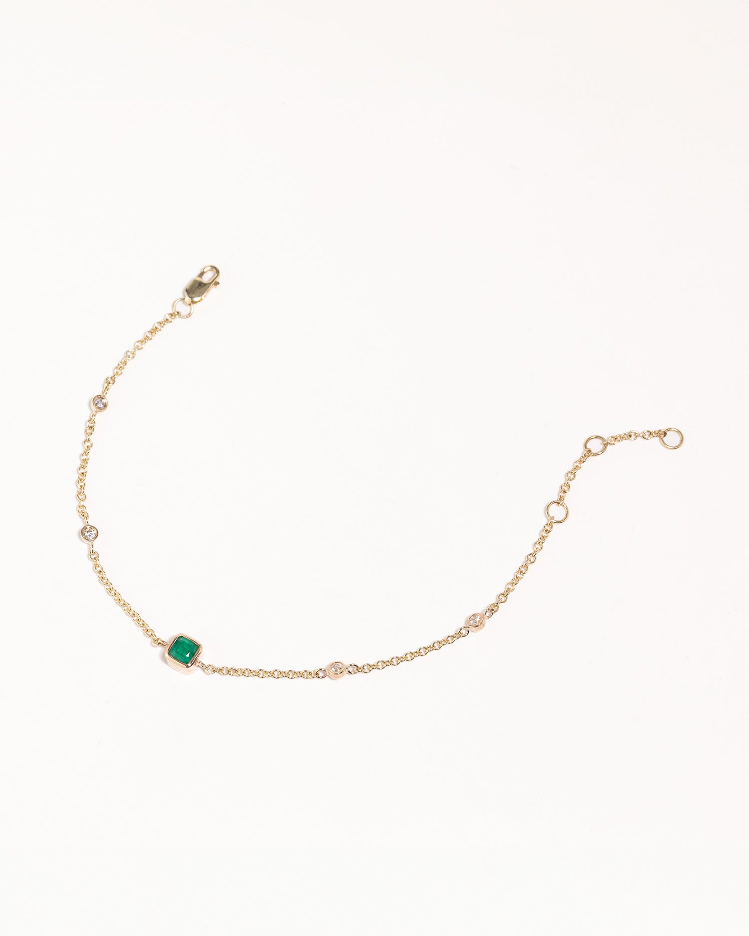 recycled 9ct solid gold bracelet with lab grown diamonds and cushion cut emerald handcrafted in London by Maya Magal London