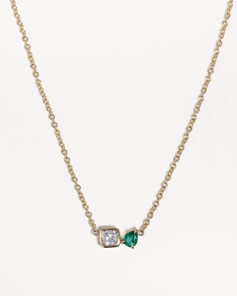 toi et moi necklace with 0.36ct lab grown diamond and pear cut emerald. Handcrafted in London by Maya Magal London 