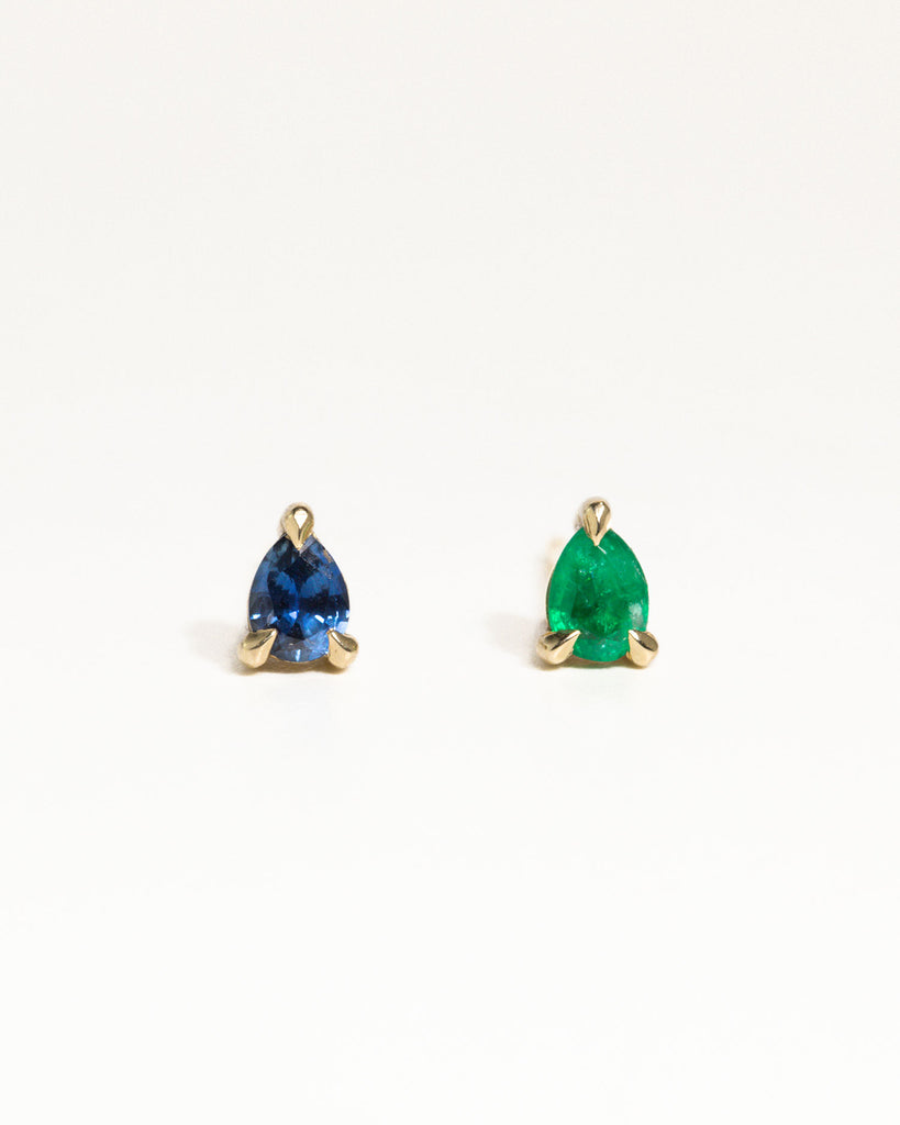 pear cut natural emerald stud earring encased in recycled solid gold handcrafted in London by Maya Magal London