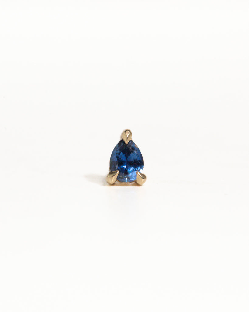 pear cut natural sapphire stud earring encased in recycled solid gold handcrafted in London by Maya Magal London