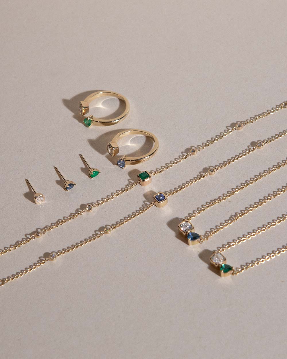 pear cut natural sapphire stud earring encased in recycled solid gold handcrafted in London by Maya Magal London