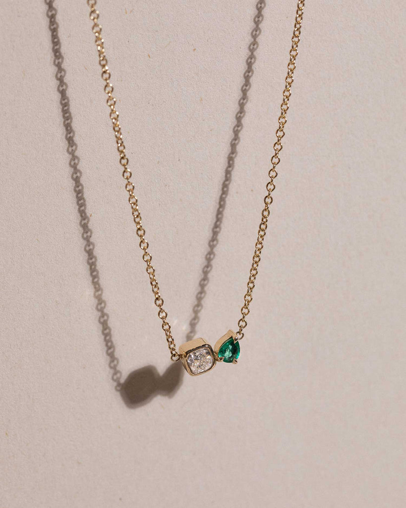 toi et moi necklace with 0.36ct lab grown diamond and pear cut emerald. Handcrafted in London by Maya Magal London