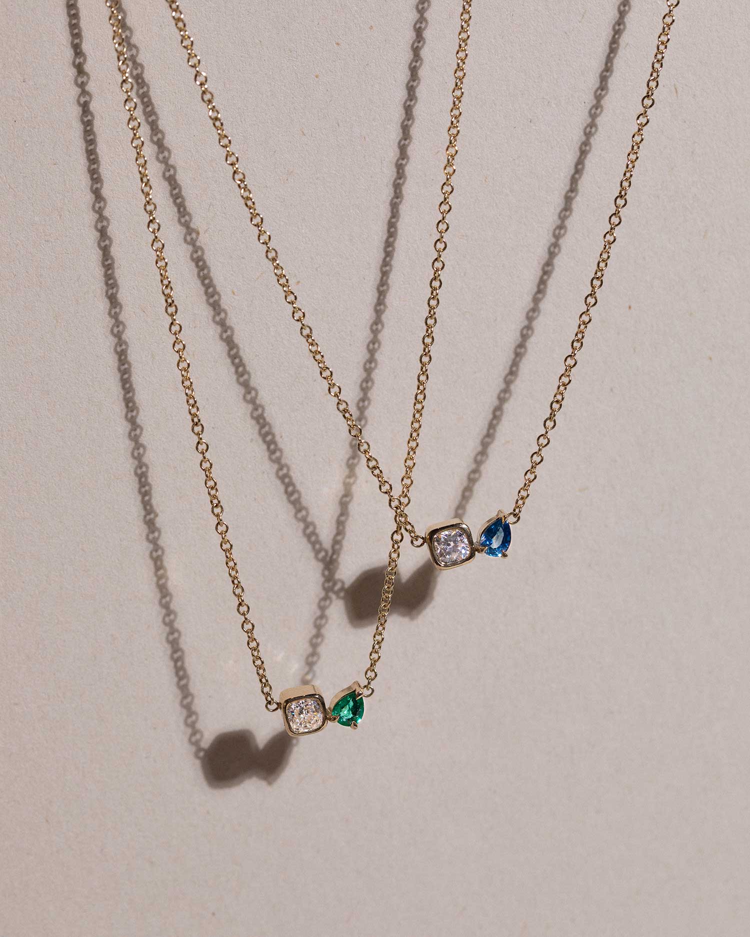 toi et moi necklace with 0.36ct lab grown diamond and pear cut emerald. Handcrafted in London by Maya Magal London