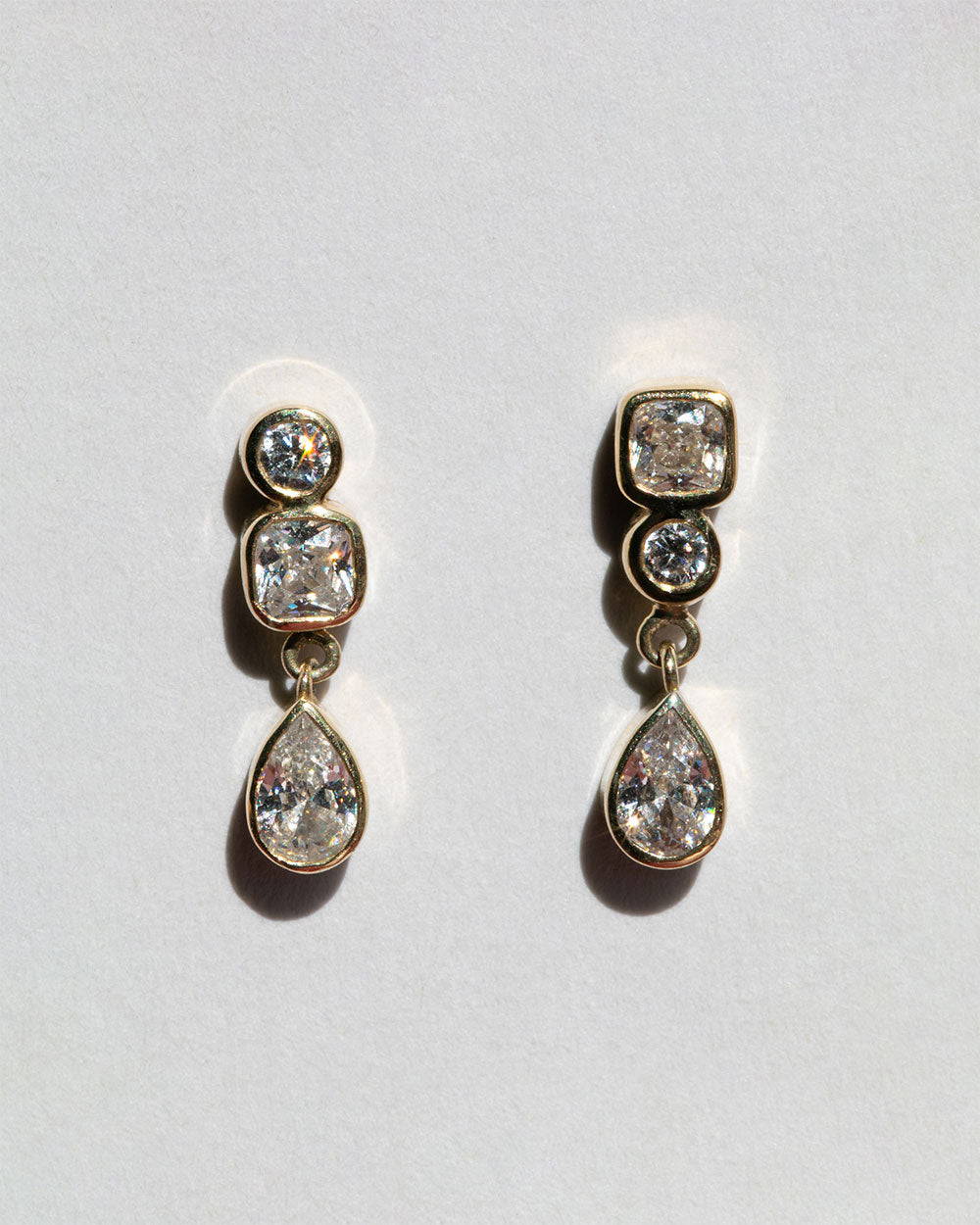 Vega Diamond Earrings on white background. 