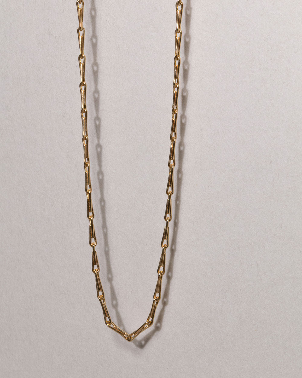 Solid Gold Wheat Chain Necklace on white background close up