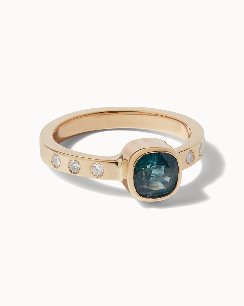 One of a kind ring in solid gold with a montana sapphire and responsibly-sourced diamonds made in London by Maya Magal